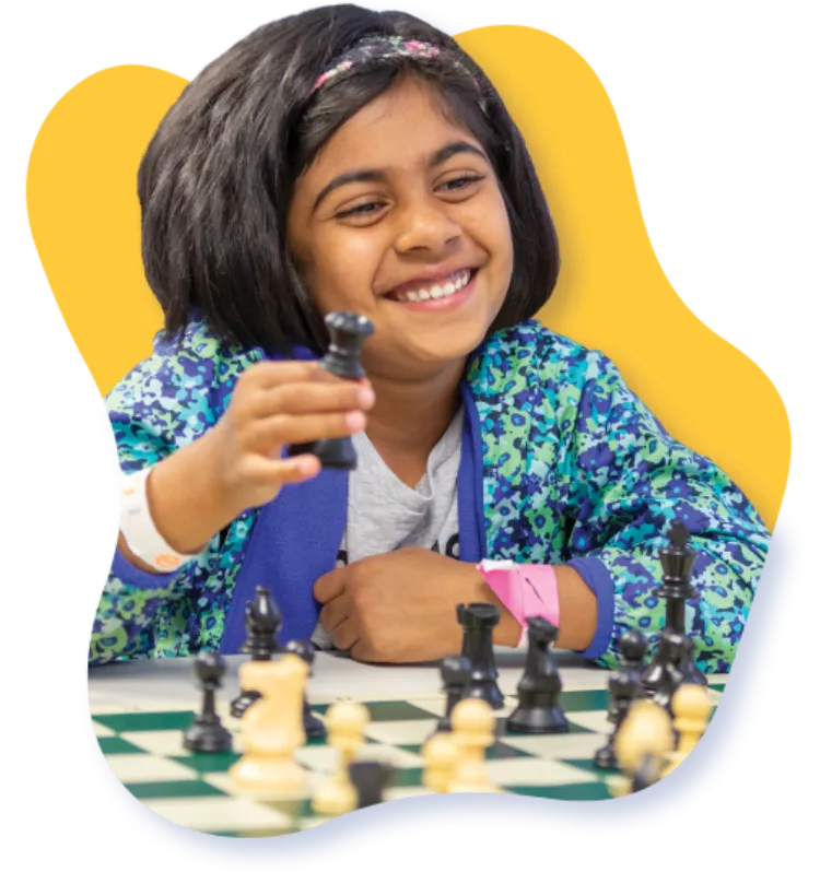  smiling girl playing chess